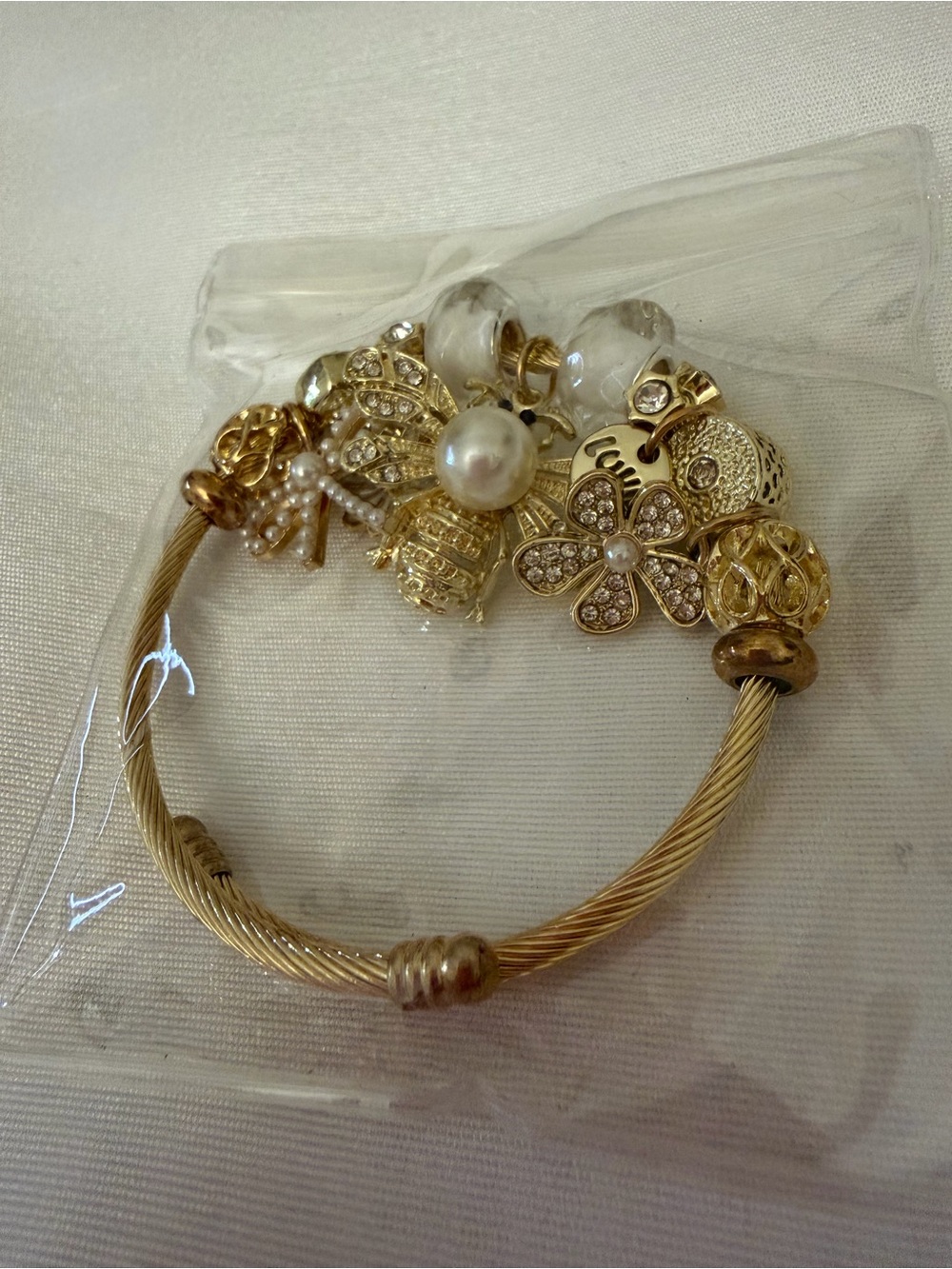 Gold-Tone Charm Bangle Bracelet with Rhinestone Flower & Pearl Accents